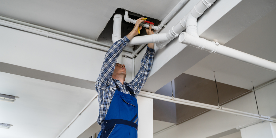 Plumber Repairing Water Pipes